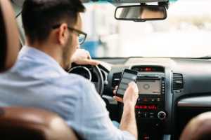Should reading while driving be banned like tech devices?