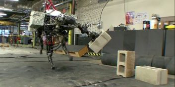 BigDog tosses cinder blocks across the room like a robotic boss