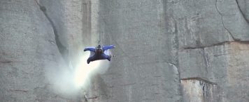 Alexander Polli flies his wingsuit through a tiny hole at 155 MPH